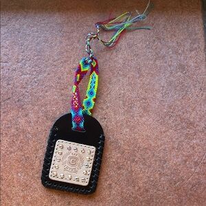 Consuela Black Leather Tag with Multicolor Woven Strap